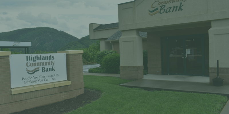 Green filtered image of the outside of a Highlands Community Bank building and sign
